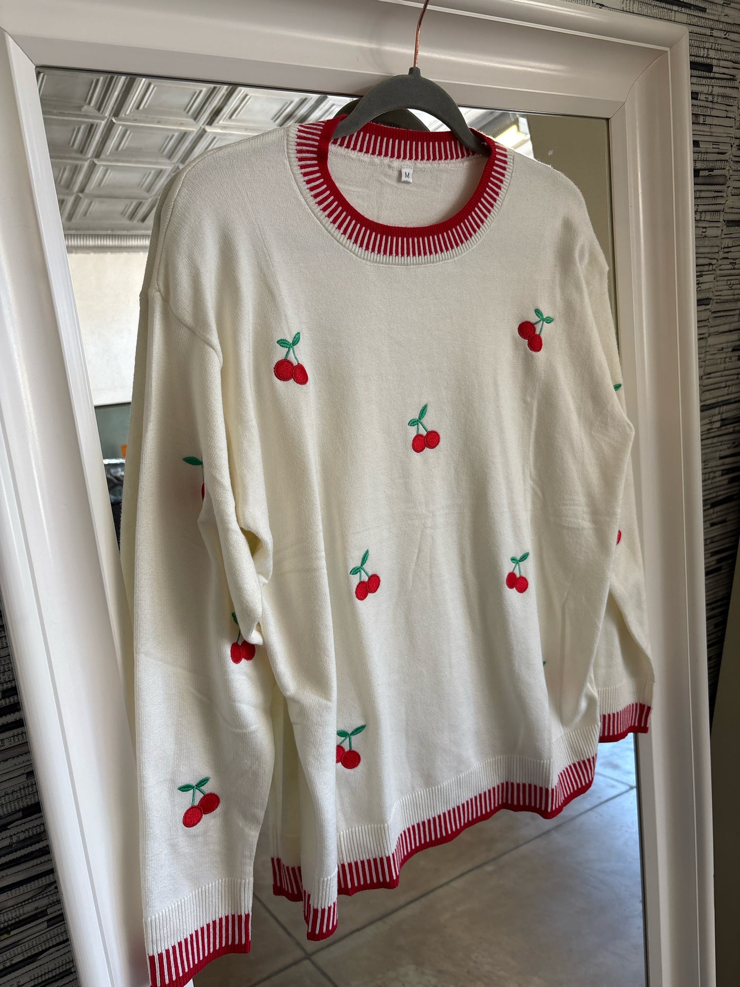 Size M cream + red Sweater